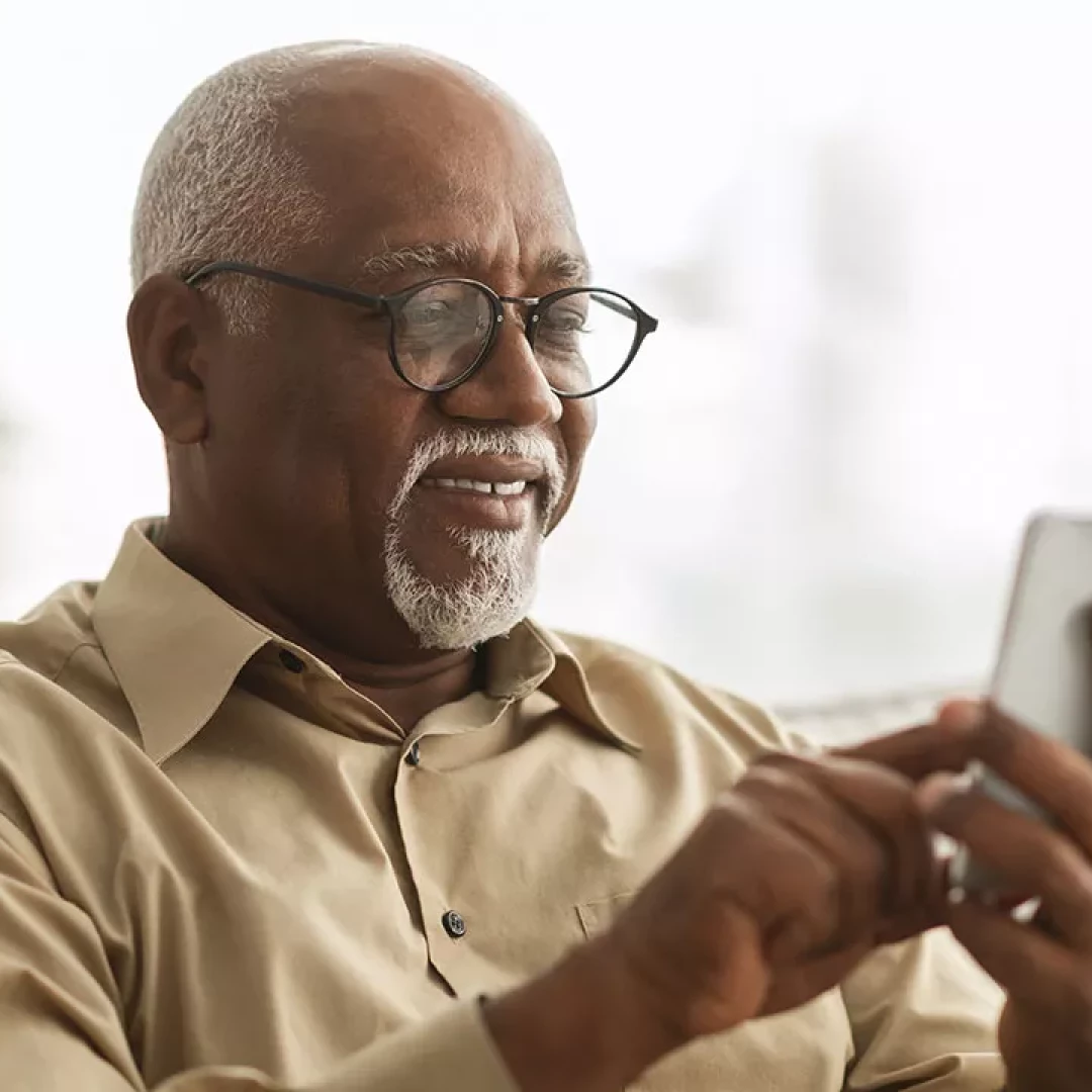 Older man looking at his smartphone