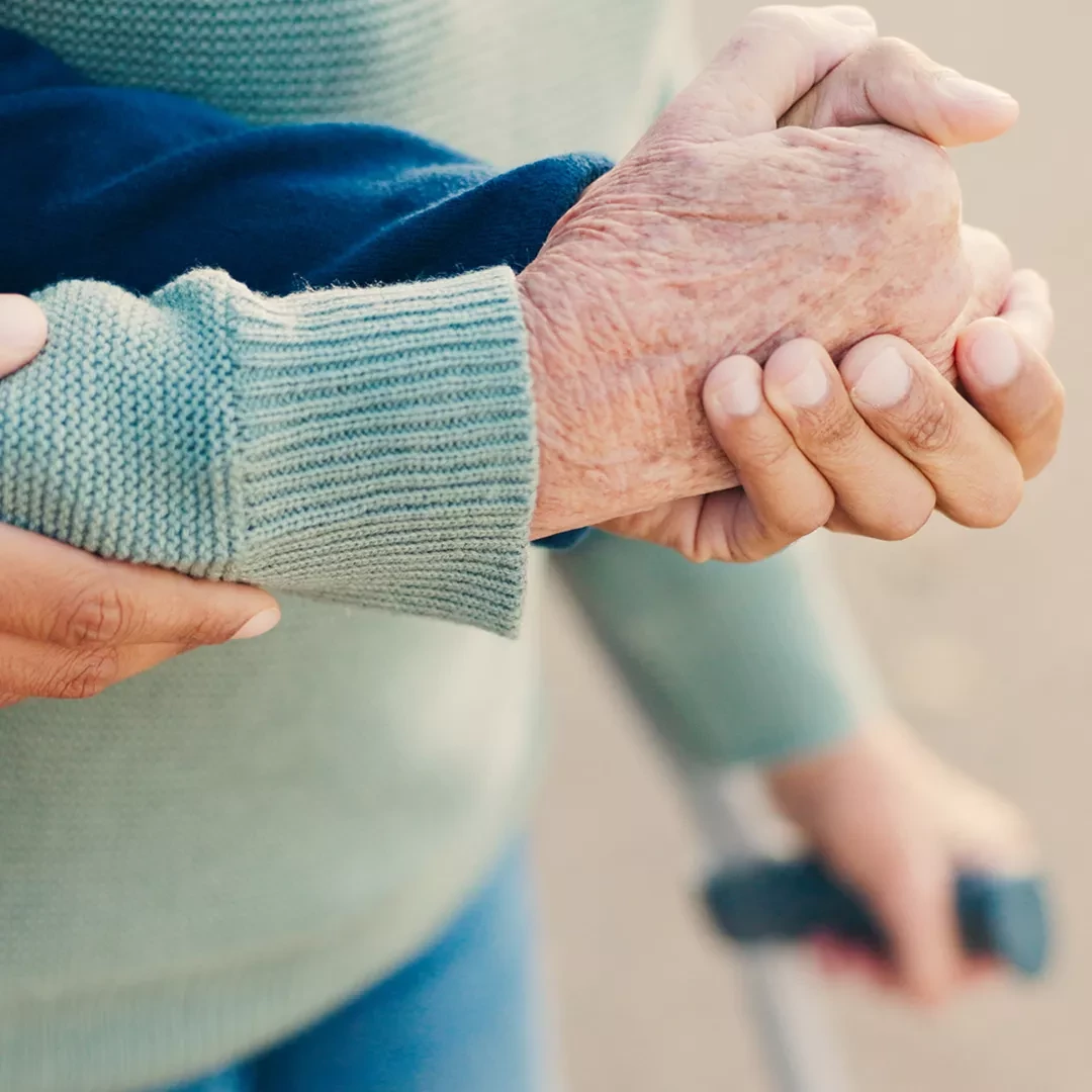 Person assisting another elderly person