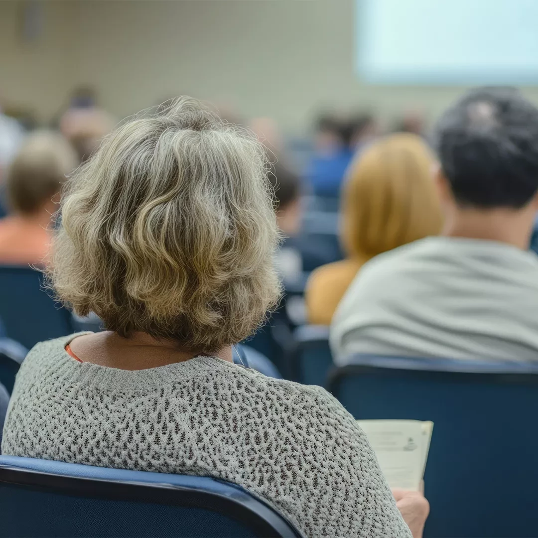 Group of older adults sitting at a presentation