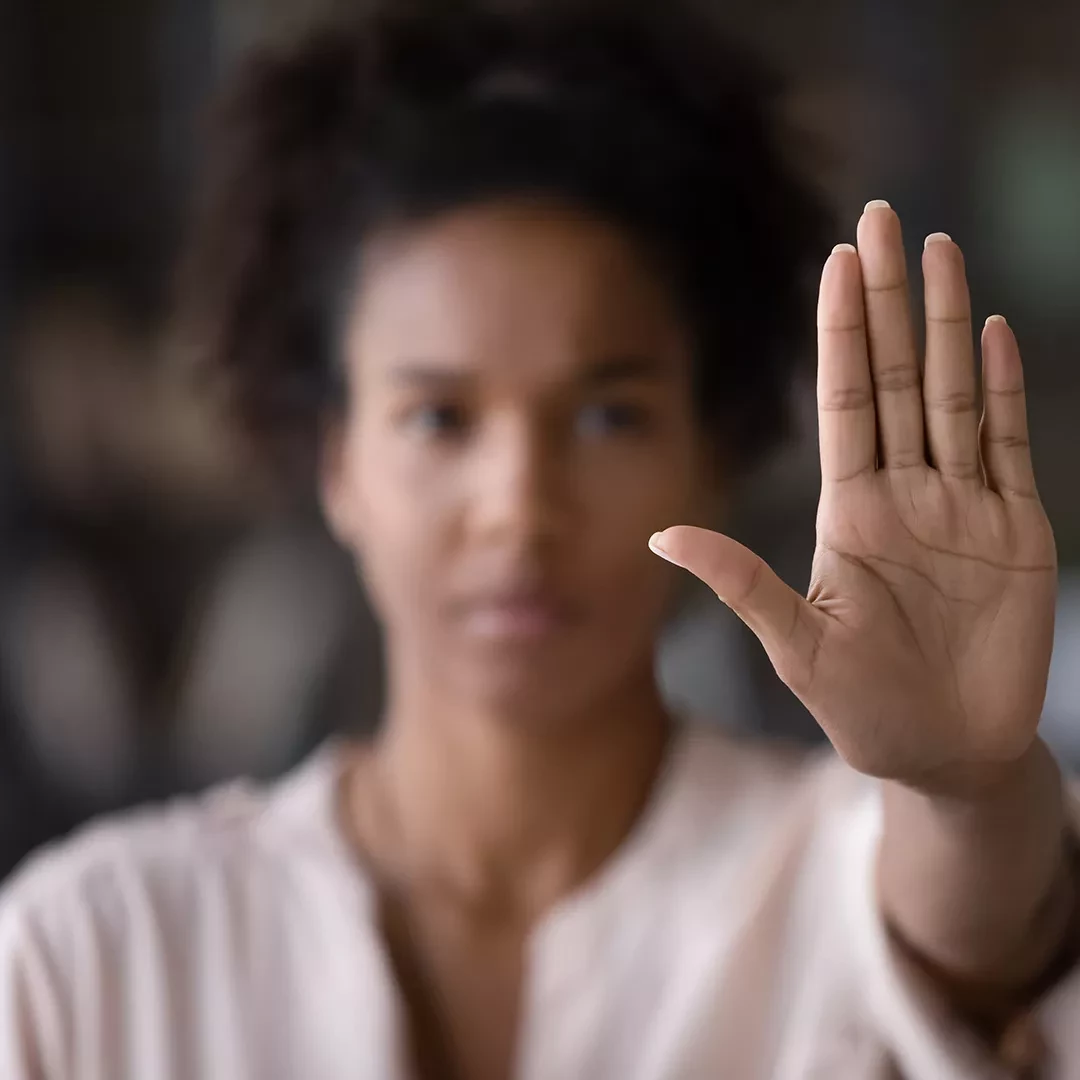 Woman with her hand held out flat