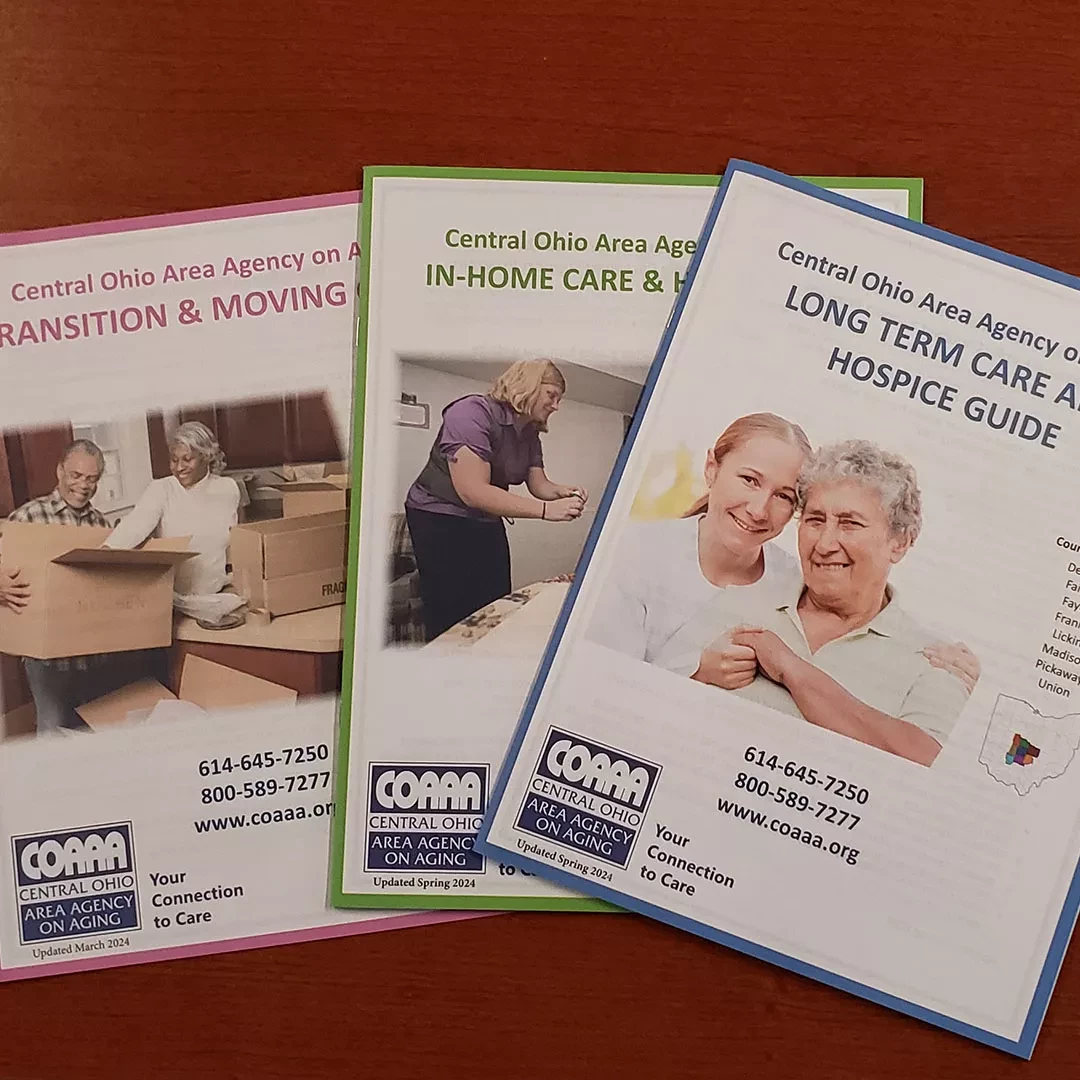 COAAA resource guides on a table